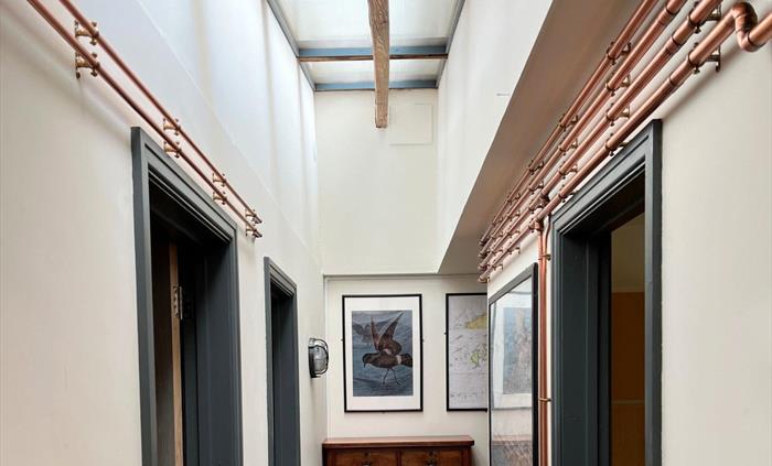 An entrance hall with doors leading off it.